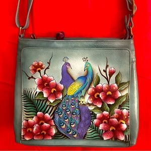 Beautiful turquoise ANUSCHKA bag never used has a lot of pockets .